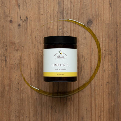 Omega-3 Tiegel mit Algenöl auf Holztisch von Naturstoff